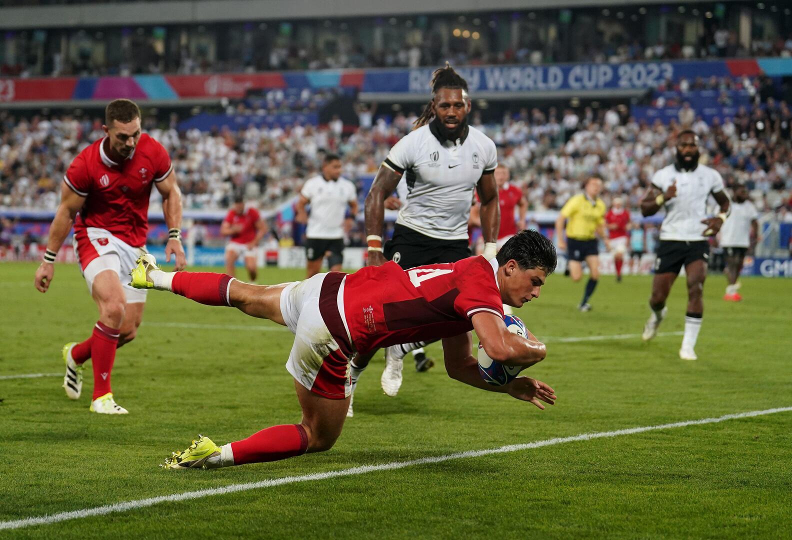 Wales' Louis Rees-Zammit scores their side's third try during the 2023 Rugby World Cup Pool C match at the Stade de Bordeaux, France. Picture date: Sunday September 10, 2023.
