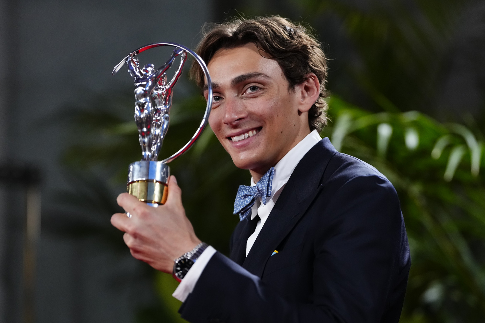 Mondo Duplantis holding the Laureus World Sportsman of the Year award.