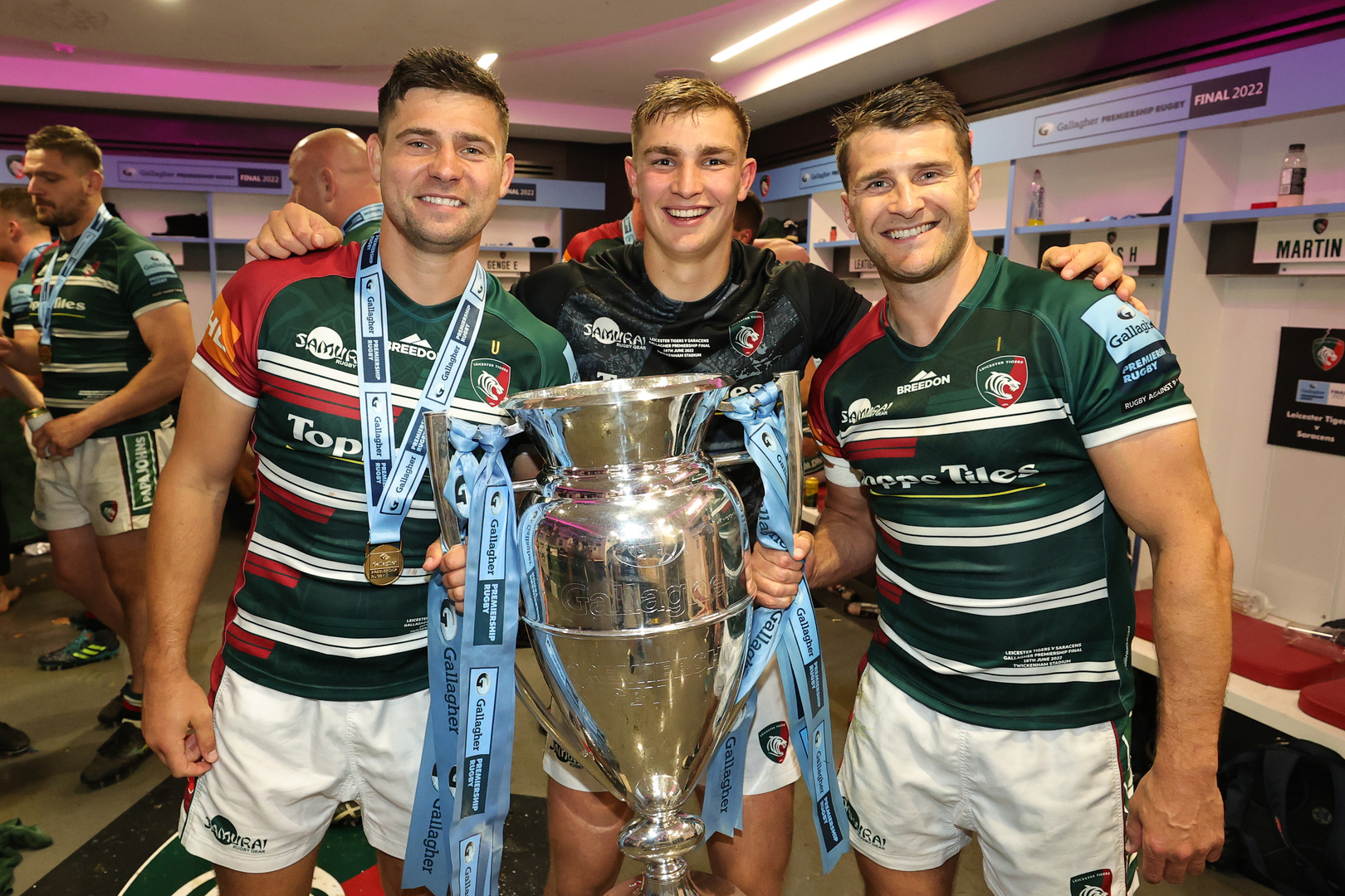 Leicester Tigers rugby players with the Gallagher Premiership Trophy.